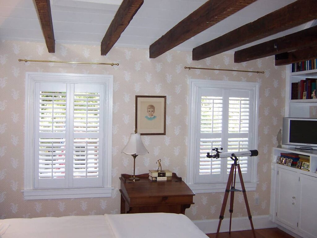 bedroom windows with interior shutters made with 2 1/2" louvers