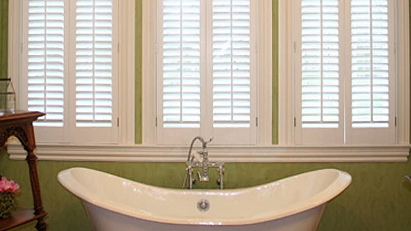 classic 2 1/2 inch shutters above a tub