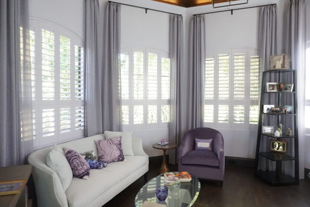 interior shutters with 3 1/2" louvers on arched windows