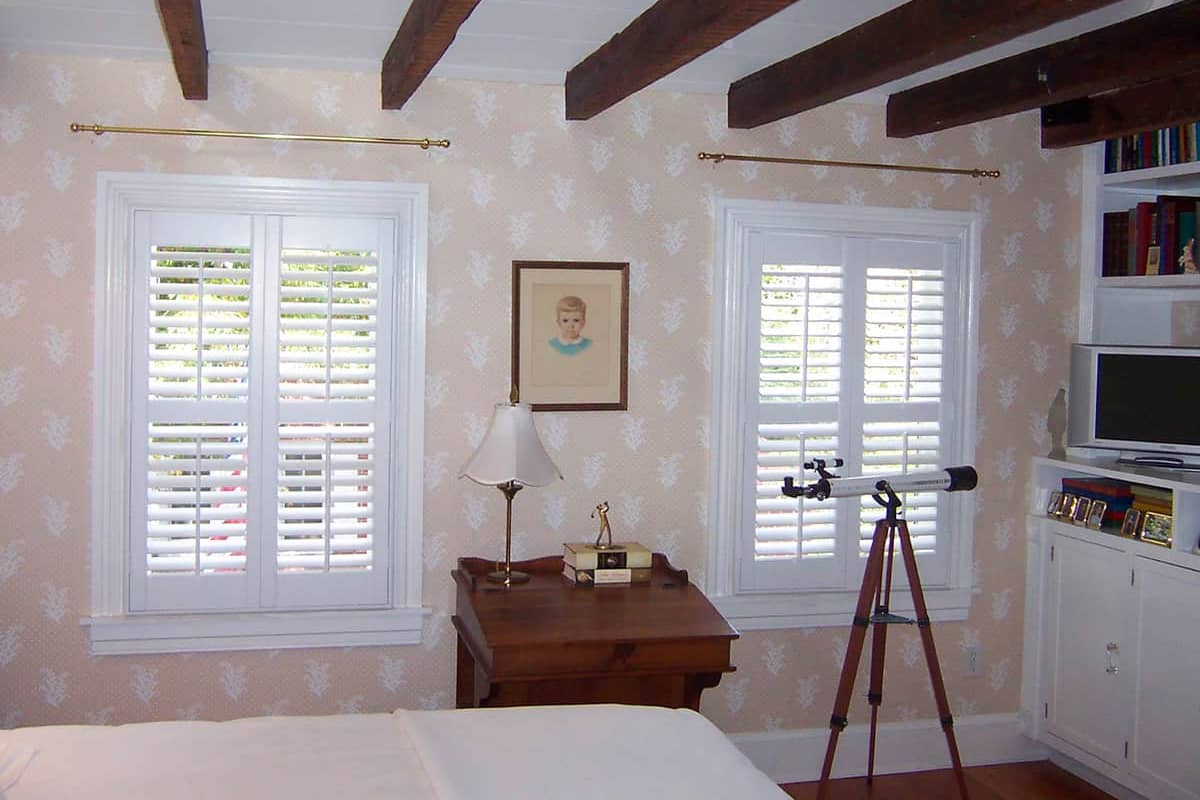 bedroom windows with interior shutters made with 2 1/2" louvers
