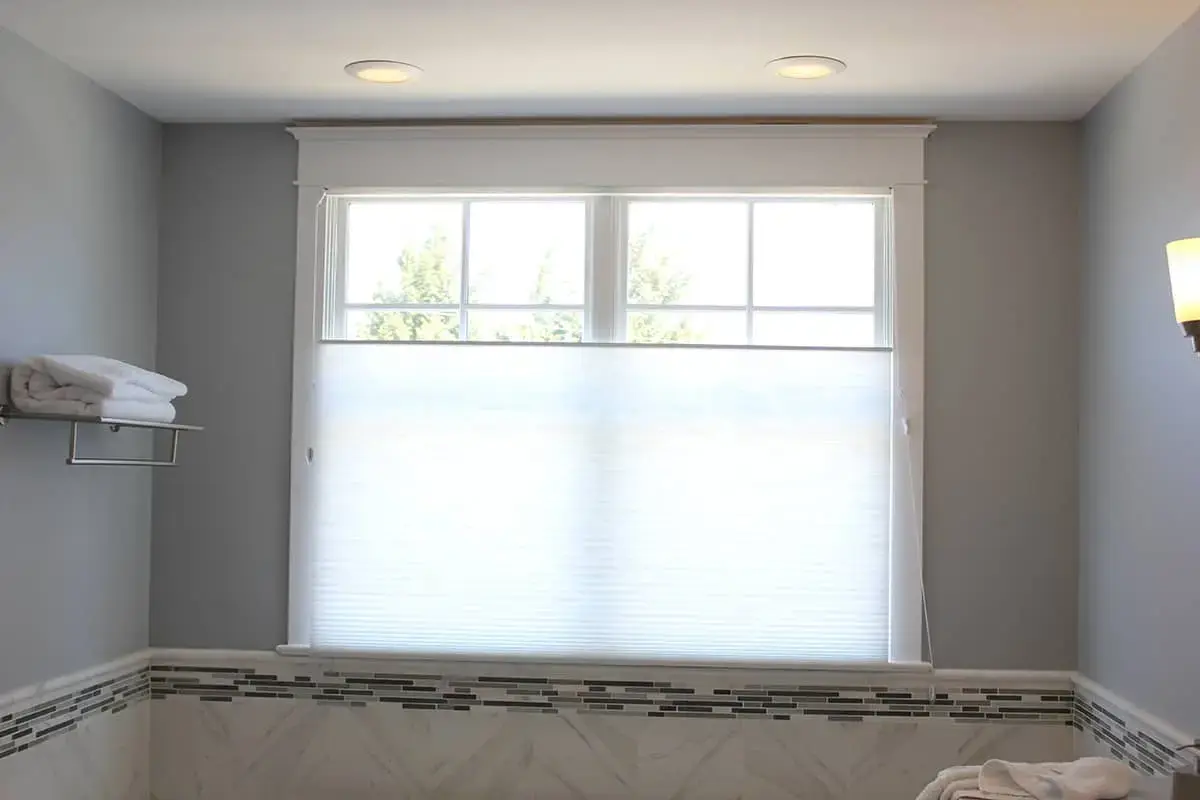 top-down / bottom-up honeycomb shades above a bathtub